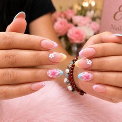 Ely Nails & Spa - Soft pink French tips with delicate 3D floral designs - fresh, feminine, and handcrafted at Ely Nails & Spa