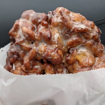 Keene Donut - a person holding a bag of donuts - Donuts Near Me - Keene, Texas Keene Donut - a person holding a bag of donuts - Donuts Near Me - Keene, Texas