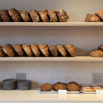 Ad Astra Bread Co - Rows of freshly baked country loaf on the back shelf - Bakeries Near Me - Monterey, California