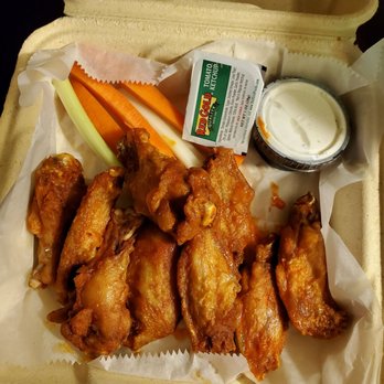 The Foundry - a tray of chicken wings and carrots - American Near Me - Jay, Vermont