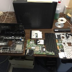 A laptop has been disassembled in order to replace the processor fan.