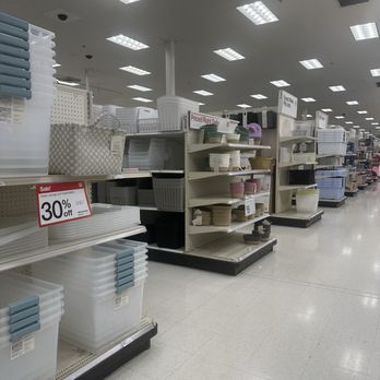 Target - Store shelves display plastic storage bins, bowls, and containers with sale signs, in a retail store aisle. - Department Stores Near Me - Saint Peters, Missouri