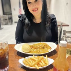 Fezzo's Seafood Steakhouse and Oyster Bar - Wifey with Fried Catfish Festival, with Crawfish Etouffee over rice.
