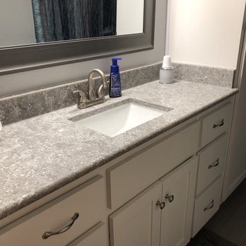 Elite Granite and Marble - a bathroom sink and toilet - Countertop Installation Near Me - Buda, Texas