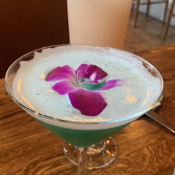 Gary's at the Belvedere - a drink with a flower on the rim - American Near Me - Santa Rosa, California Gary's at the Belvedere - a drink with a flower on the rim - American Near Me - Santa Rosa, California