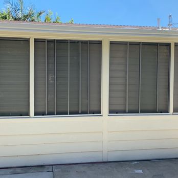 A Blinds - Exterior view of alternating light grey blinds - Shutters Near Me - Buena Park, California A Blinds - Exterior view of alternating light grey blinds - Shutters Near Me - Buena Park, California