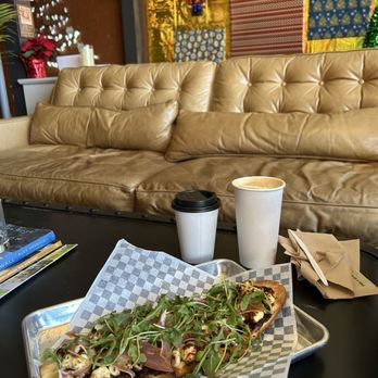 Chandlers - Notorious Fig flatbread, latte, oatmilk latte with a touch of hot honey - Coffee & Tea Near Me - Greensboro, North Carolina Chandlers - Notorious Fig flatbread, latte, oatmilk latte with a touch of hot honey - Coffee & Tea Near Me - Greensboro, North Carolina