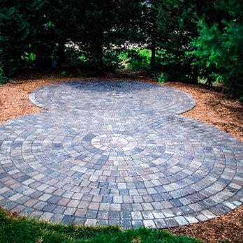 P.H.M. Incorporated - a circular brick patio - Landscaping Near Me - Maplewood, Minnesota P.H.M. Incorporated - a circular brick patio - Landscaping Near Me - Maplewood, Minnesota