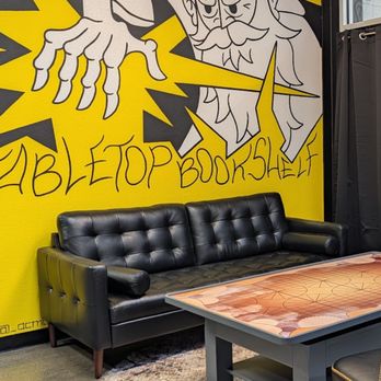 Tabletop Bookshelf - Photo of our lounge space and custom mural with reservable tables and space for events. - Bookstores Near Me - Milwaukee, Wisconsin Tabletop Bookshelf - Photo of our lounge space and custom mural with reservable tables and space for events. - Bookstores Near Me - Milwaukee, Wisconsin