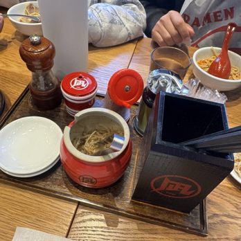 Ramen Nagi - Bean sprouts and condiments including sesame seed available on table 2.21.26 - Ramen Near Me - Costa Mesa, California