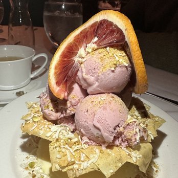 Vintage Press - Blood orange pistachio ice cream sprinkled with roasted coconut shavings nestled in a puff pastry basket - American Near Me - Visalia, California Vintage Press - Blood orange pistachio ice cream sprinkled with roasted coconut shavings nestled in a puff pastry basket - American Near Me - Visalia, California