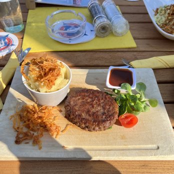Der Pschorr - Beef Patty and mash potatoes with crispy onions on top. Side of BBQ sauce. Delicious! - Bavarian Near Me - Munich, BY Der Pschorr - Beef Patty and mash potatoes with crispy onions on top. Side of BBQ sauce. Delicious! - Bavarian Near Me - Munich, BY