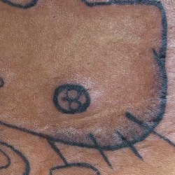 Inked Arts Tattoo Studio - Eye isn't filled in tail isn't shaded lines aren't the same thickness.