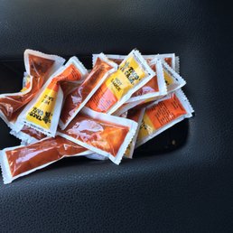 a pile of taco chips in a car seat