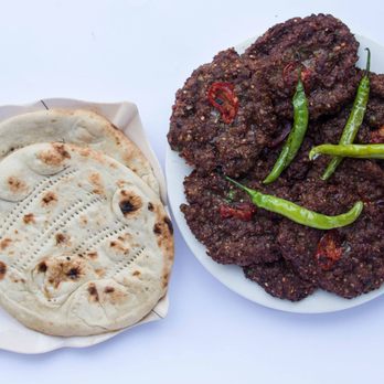 Mazar Cuisine - a plate of food and a flatbread - Afghan Near Me - Kent, Washington Mazar Cuisine - a plate of food and a flatbread - Afghan Near Me - Kent, Washington