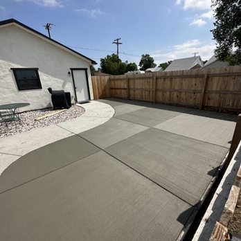 Retriever Landscaping - a concrete driveway in a backyard - Landscaping Near Me - Platteville, Colorado Retriever Landscaping - a concrete driveway in a backyard - Landscaping Near Me - Platteville, Colorado