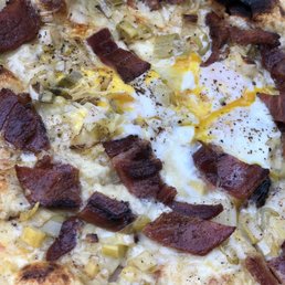 Bianco Pizza (Roasted leeks with Organic Cowgirl Creamery Wagon Wheel Cheese, Bacon and Farm Egg). Bianco Pizza (Roasted leeks with Organic Cowgirl Creamery Wagon Wheel Cheese, Bacon and Farm Egg).