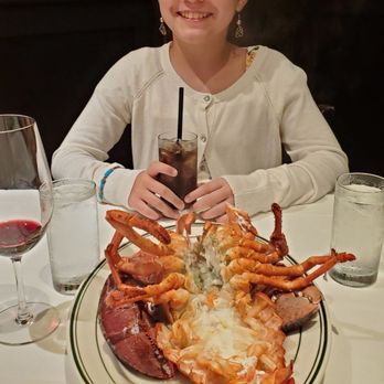Wolfgang's Steakhouse - 3.5 lb. Lobster and my daughter all dressed up! - Steakhouses Near Me - Honolulu, Hawaii