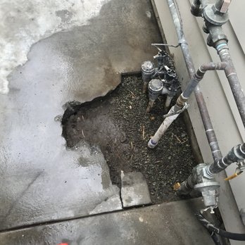 Sherlock Leak Detection - The actual location of the leak, with the concrete dug up and compacted after the leak was fixed - Plumbing Near Me