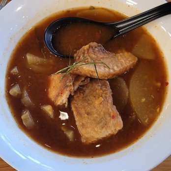 Chao Baan - Gaeng Som - spicy soup with green papaya slices and fried white fish - Thai Near Me - St. Louis, Missouri Chao Baan - Gaeng Som - spicy soup with green papaya slices and fried white fish - Thai Near Me - St. Louis, Missouri