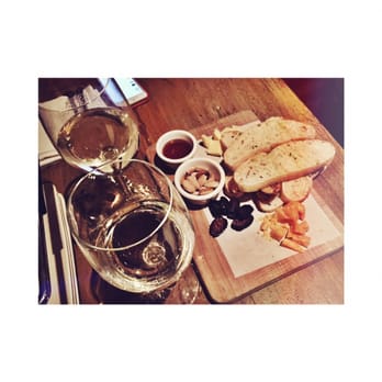 Barrique Kitchen & Wine Bar - Pinot Grigio and aged cheddar and Gouda cheese plate. Comes with nuts, figs and honey. - Tapas Bars Near Me - Babylon, New York