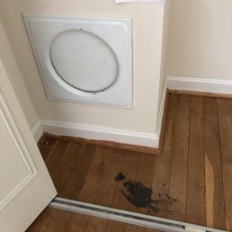 BEFORE photo of closet with laundry chute. BEFORE photo of closet with laundry chute.