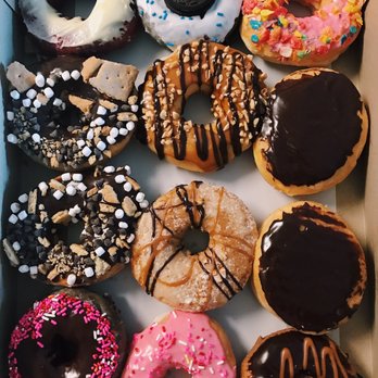 Donut Kingdom - A dozen of some of my favorite donuts. S'mores, red velvet, snickers, and Oreo ! - Donuts Near Me - Tallahassee, Florida