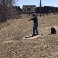 Scottville Riverside Park - Husband playing disc golfing