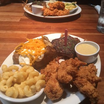 Cheddar's Scratch Kitchen - Medium rare 6oz Sirloin steak with chicken tenders and fried onions and a side of Mac'N cheese and a loaded baked potato. - Comfort Food Near Me - Pinellas Park, Florida