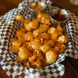 Brunson's Pub - Cheese curds battered with summit beer, served with balsamic aioli and sambal honey dipping sauces
