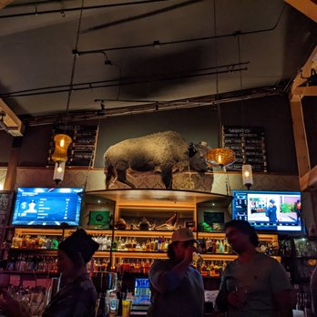 River Pig Saloon - a large stuffed animal above the bar - Cocktail Bars Near Me - Bend, Oregon River Pig Saloon - a large stuffed animal above the bar - Cocktail Bars Near Me - Bend, Oregon