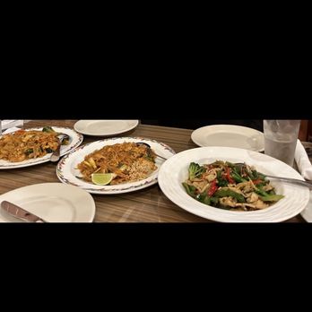 Thai Bangkok - Sesame chicken (not crispy). Be sure to ask for crispy if you want that-we didn't clarify. Chicken Pad Thai. Shrimp Drunken Noodles left - Thai Near Me - High Point, North Carolina