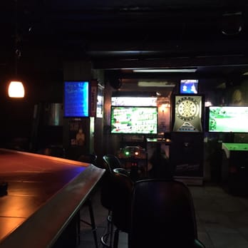 Smugglers Tavern - a bar with two televisions in the background - Sports Bars Near Me - Tierra Verde, Florida Smugglers Tavern - a bar with two televisions in the background - Sports Bars Near Me - Tierra Verde, Florida