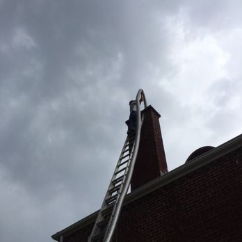 Wolfe & Sons Heating and Cooling - Jeff installing a flue liner for the new furnace vent - Heating & Air Conditioning/HVAC Near Me - Columbus, Ohio