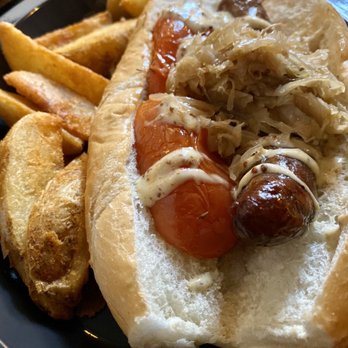 Leaky Cauldron™ - Banger Sandwich with Wedge Fries - British Near Me - Orlando, Florida Leaky Cauldron™ - Banger Sandwich with Wedge Fries - British Near Me - Orlando, Florida
