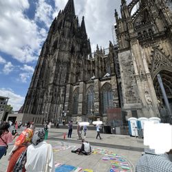 Kölner Dom - Chalk artists draw international flags on the pavement, but they intentionally fly the Turkish flag and claim it's out of cultural respect
