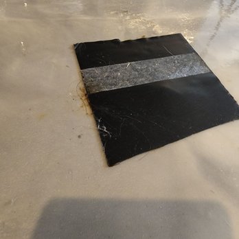 Stabil-Loc - a black and white strip on the floor - Waterproofing Near Me - Owensboro, Kentucky