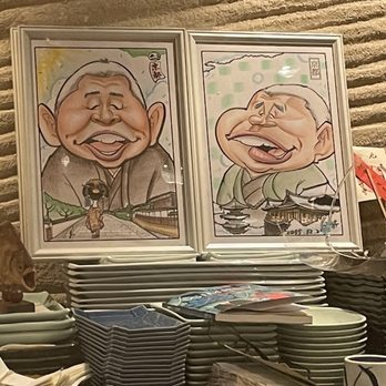 Kurumazushi - a stack of plates and a picture of a man with a mustache - Sushi Bars Near Me - New York, New York Kurumazushi - a stack of plates and a picture of a man with a mustache - Sushi Bars Near Me - New York, New York