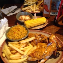 Nando's - Half hot chicken, chips, spicy rice and corn on cob