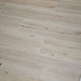 Acord Home Improvements - Installed wood plank porcelain tile onto concrete slab. - Flooring Near Me - Holly Ridge, North Carolina
