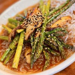 Takashi - WOK-TOSSED ASPARAGUS (CAN BE GF) Crisp spears of asparagus served with a garlic sauce, shiitake mushrooms and glass noodles.
