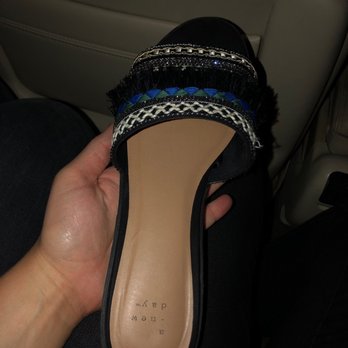 Jimmy D's - a hand holding a pair of shoes - Dance Clubs Near Me - Pittsburgh, Pennsylvania
