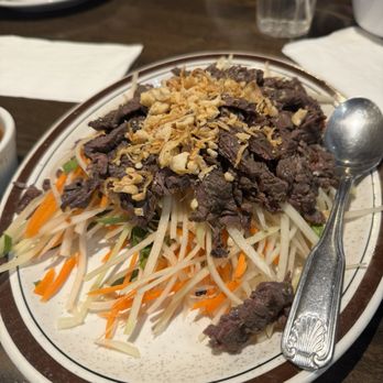 Perilla - Beef papaya salad with fried shallots and roasted peanuts YUM - Vietnamese Near Me - San Francisco, California Perilla - Beef papaya salad with fried shallots and roasted peanuts YUM - Vietnamese Near Me - San Francisco, California