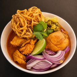 Khao Soi
Northern Thai curry noodle soup with egg noodles, pickled mustard greens, shallots, and crispy noodle topping.
