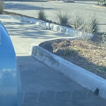 Jollibee - Be careful at drive thru.  When Jollibee employees tell you to park to the side be aware there is a blind curb here. - Chicken Shop Near Me - San Antonio, Texas