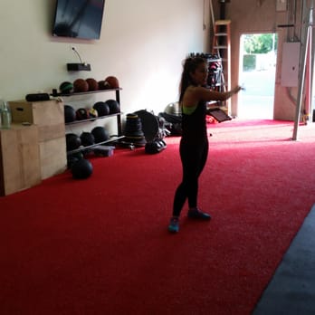 Fitness On Fire - Haydee helping a member - Gyms Near Me - Irvine, California Fitness On Fire - Haydee helping a member - Gyms Near Me - Irvine, California