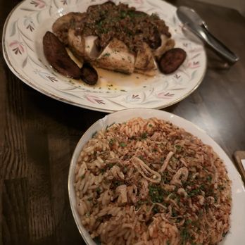 Atelie by The Experience - Half roasted chicken and party jollof fried rice - Wine Tasting Room Near Me - Dallas, Texas