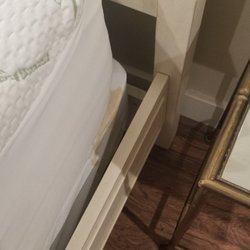 Box spring with some sort of stain.