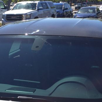 Genesis Window Tinting - The scratch on the carbon roof. This picture was taken before the car was handed back to me. - Home Window Tinting Near Me - Roseville, California Genesis Window Tinting - The scratch on the carbon roof. This picture was taken before the car was handed back to me. - Home Window Tinting Near Me - Roseville, California
