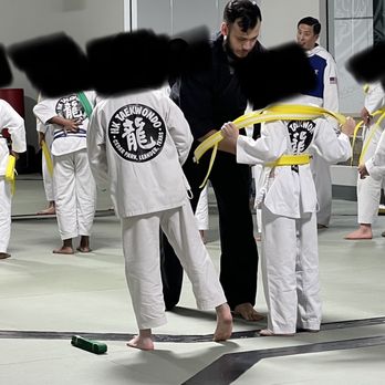 HK Taekwondo - 2 instructors putting on belts 2 different ways. Yet Master Kim will embarrass a kid who doesn't tie his belt "Kim's way". - Taekwondo Near Me - Cedar Park, Texas HK Taekwondo - 2 instructors putting on belts 2 different ways. Yet Master Kim will embarrass a kid who doesn't tie his belt "Kim's way". - Taekwondo Near Me - Cedar Park, Texas